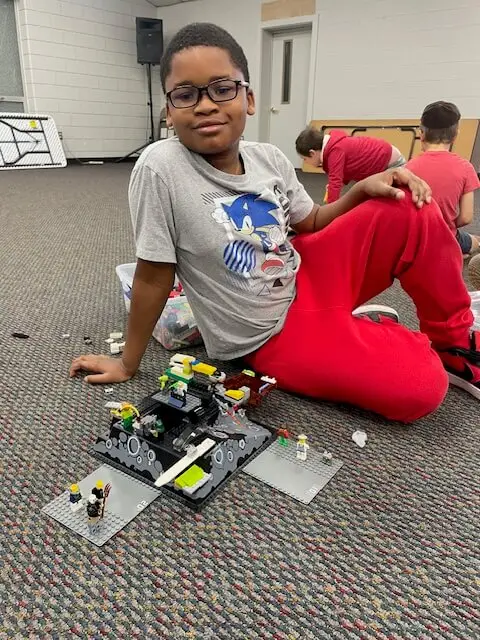 Child Building With Legos