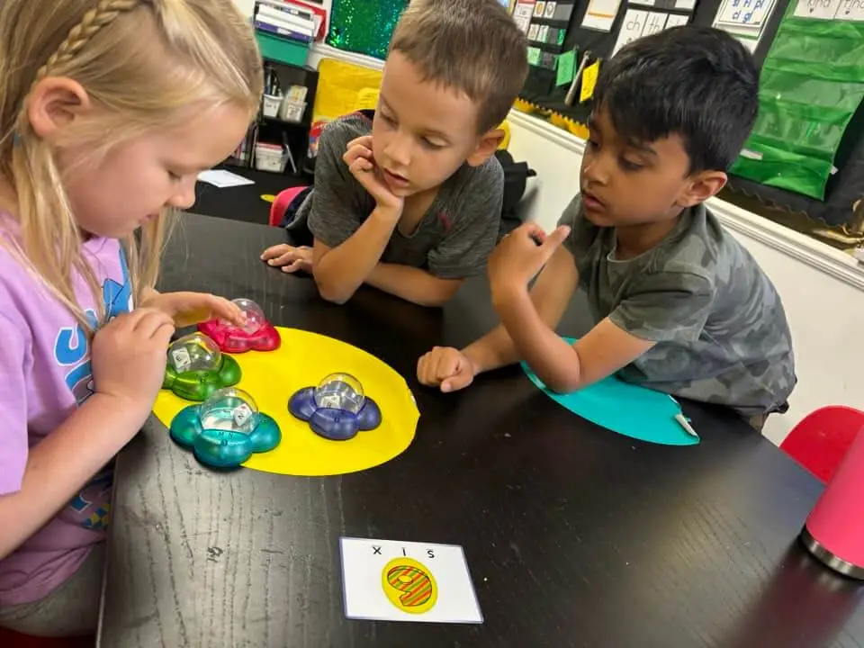 Kids At A Table Working Together